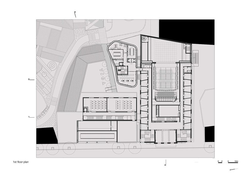 First floor plan drawing depicting upper level of auditorium with balcony seating and surrounding support spaces