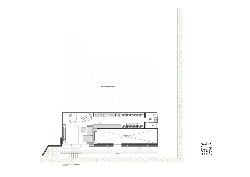 Floor plan drawing showing the interior layout with living spaces and central stairwell