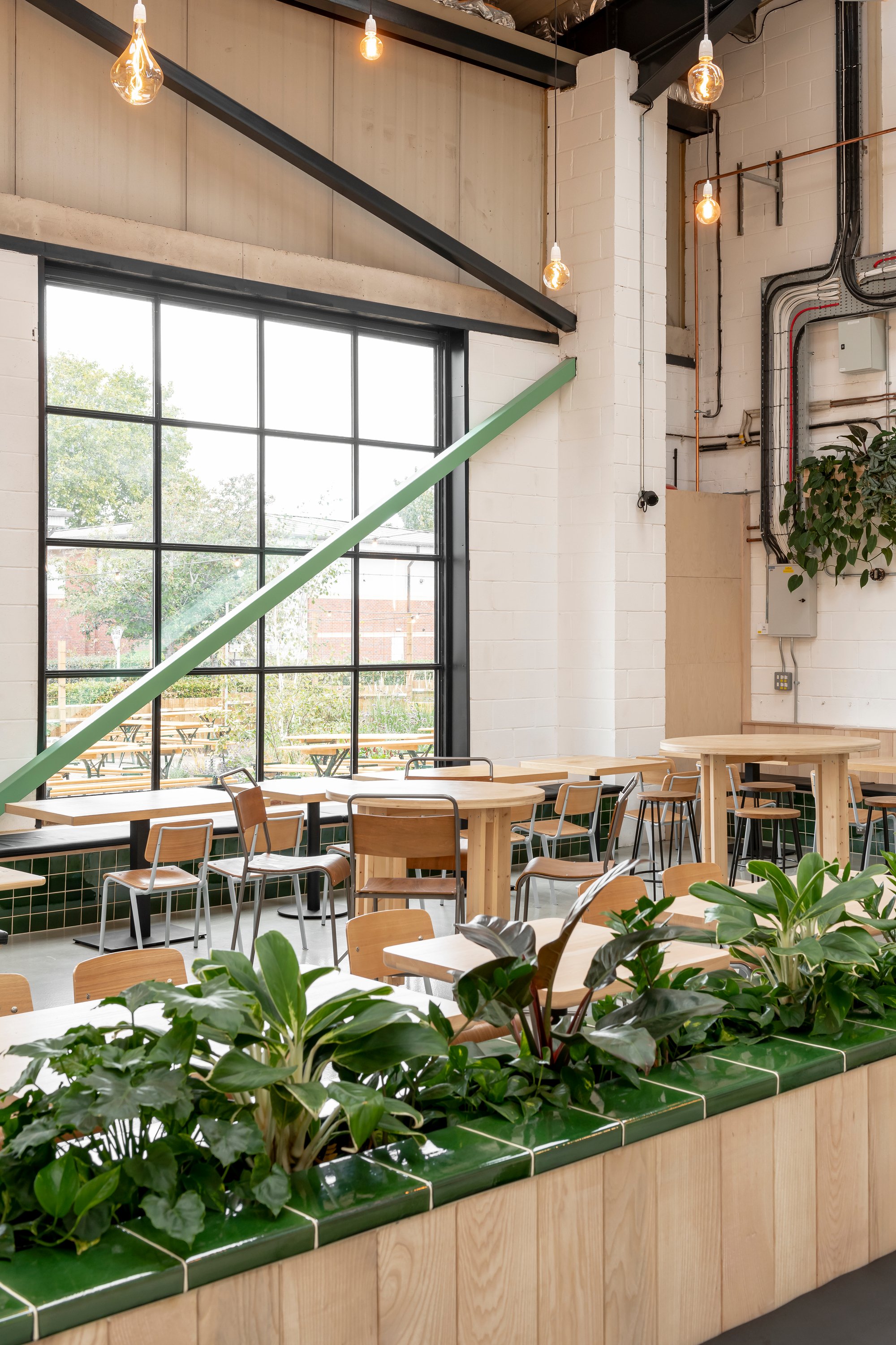 Studio B Wraps a Working Brewery in Mint Green Steel and Local Ash for Wiper and True's Bristol Taproom