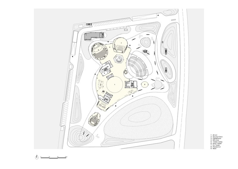 Site plan drawing showing circular and oval building volumes arranged within a landscaped perimeter