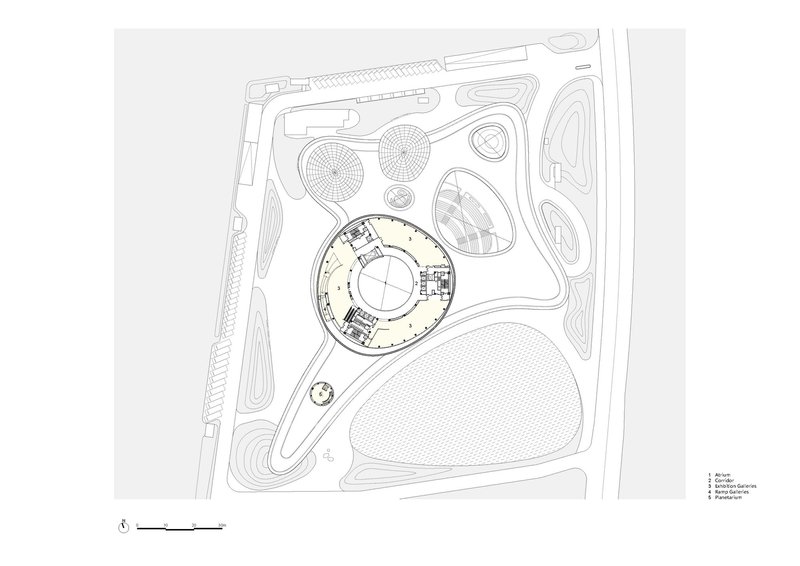 Site plan drawing highlighting one circular building volume within the overall compound