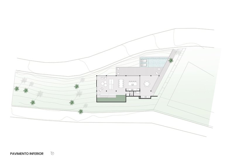 Lower floor plan drawing showing open living spaces and pool terrace on a sloped coastal site