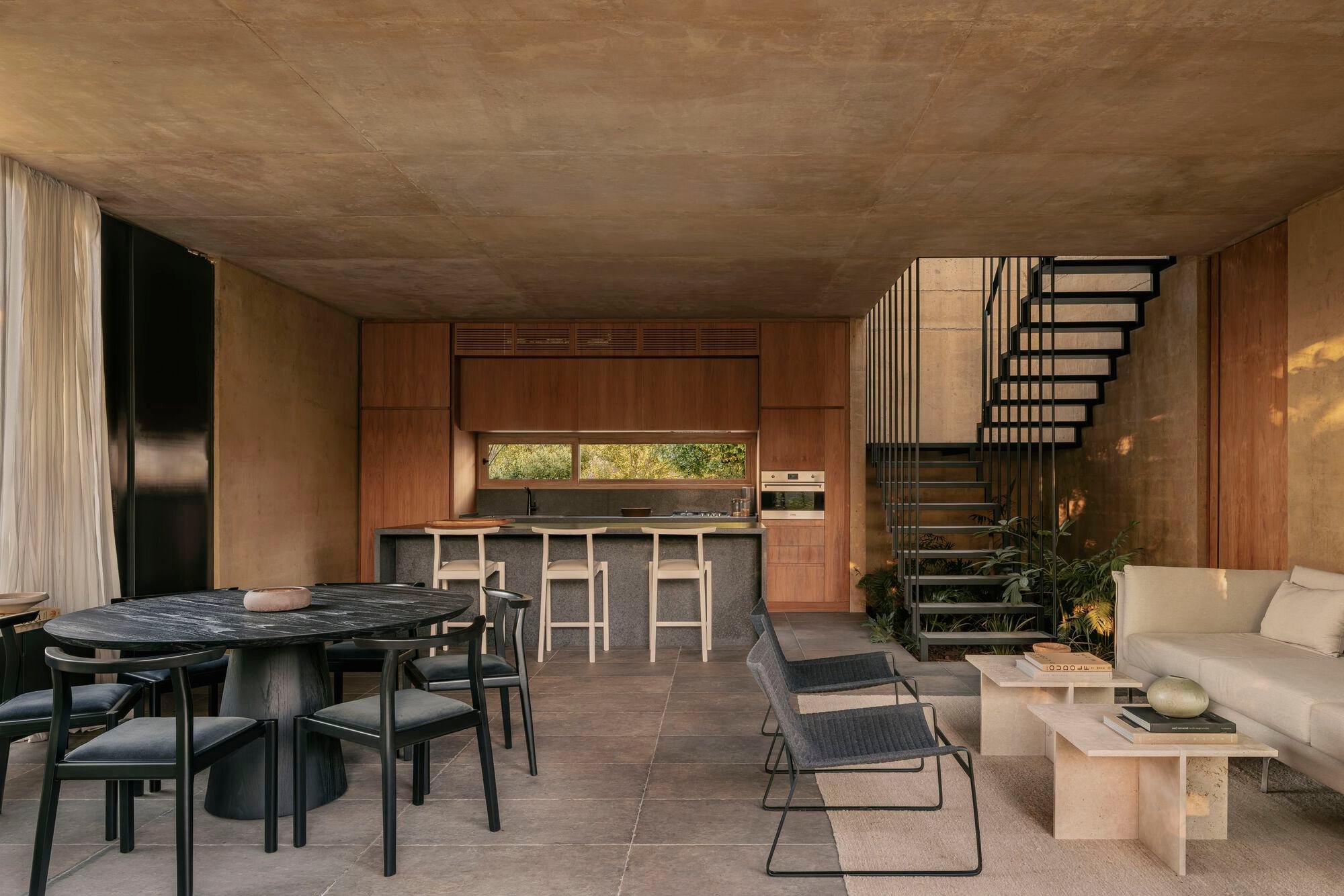 Gonzalo Bardach Shapes a Buenos Aires Dwelling from Pigmented Concrete, Timber and Filtered Light