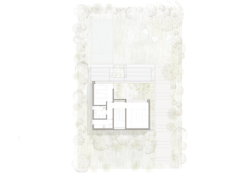 Ground floor plan showing interior rooms and an exterior deck bordered by trees