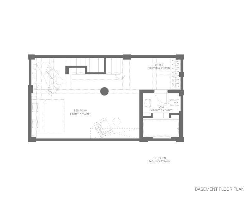 Basement floor plan drawing showing bedroom, toilet, dress room and exterior kitchen below grade