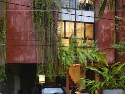 SOHO Architects Stacks Work and Living into a Pink Twin Block on a Tiny Plot in Calicut