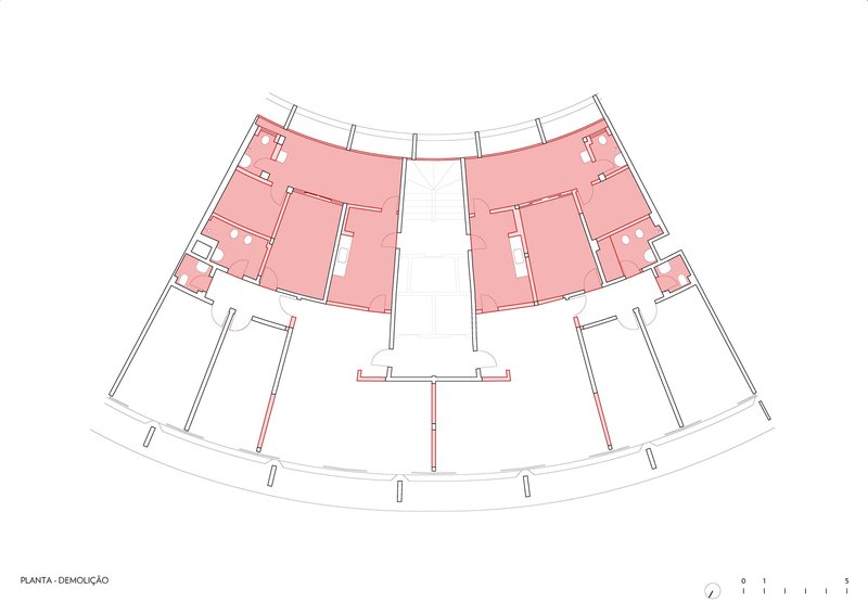 Demolition plan highlighting removed interior partitions in pink within the curved floor plate