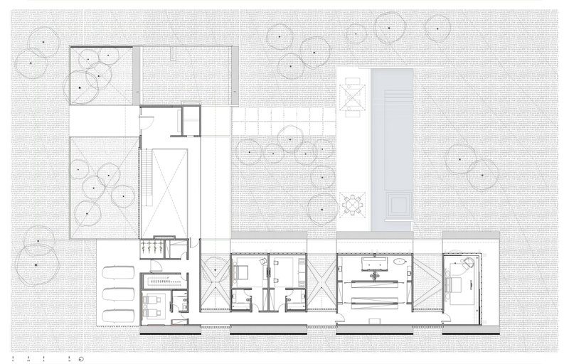 Floor plan drawing showing residential spaces and a central courtyard with trees