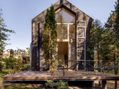 Replus Design Bureau Wraps a Forest Retreat Near Lviv in Charred Larch and Recycled Austrian Tile