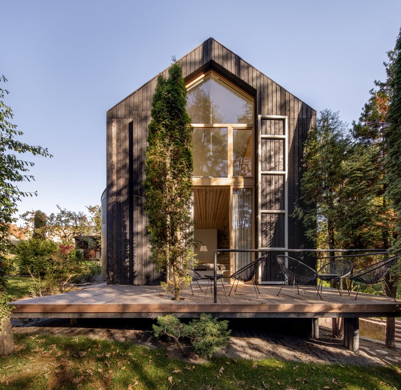 Replus Design Bureau Wraps a Forest Retreat Near Lviv in Charred Larch and Recycled Austrian Tile