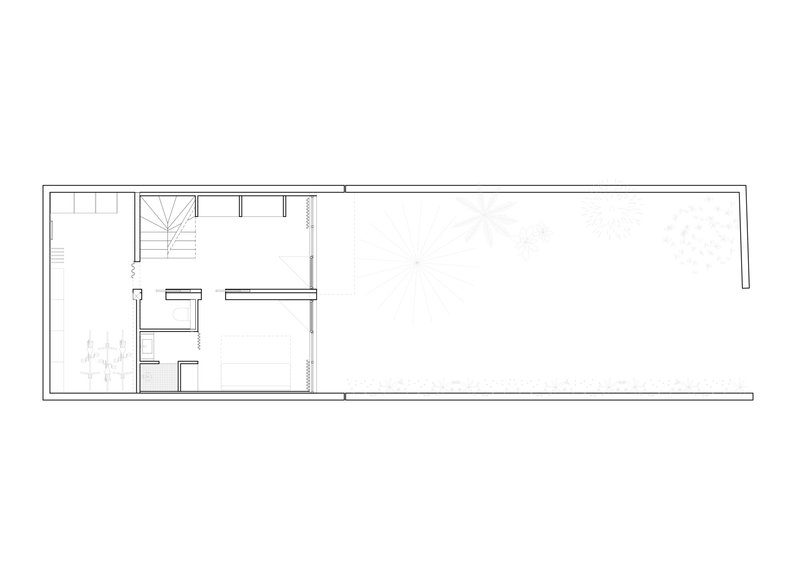 Floor plan drawing showing a long narrow volume with stair and service rooms clustered at one end