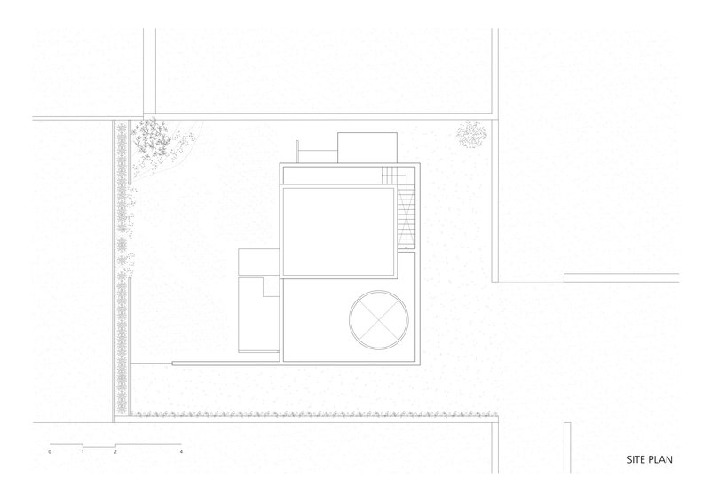 Site plan drawing showing rectangular volumes with circular element and perimeter planting