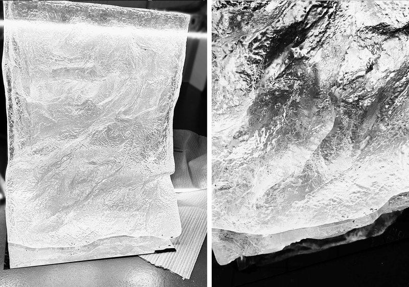 Close-up of translucent resin samples with swirling marbled patterns and air bubbles