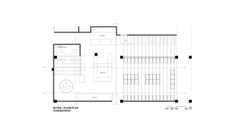 Floor plan drawing showing a rectangular layout with open workspace, staircase and central service core