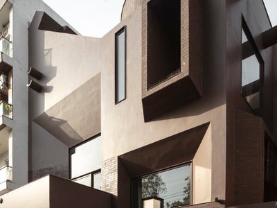 RENESA Channels Corbusian Brutalism into a Four-Story New Delhi Home Clad in Burnt Sienna Brick