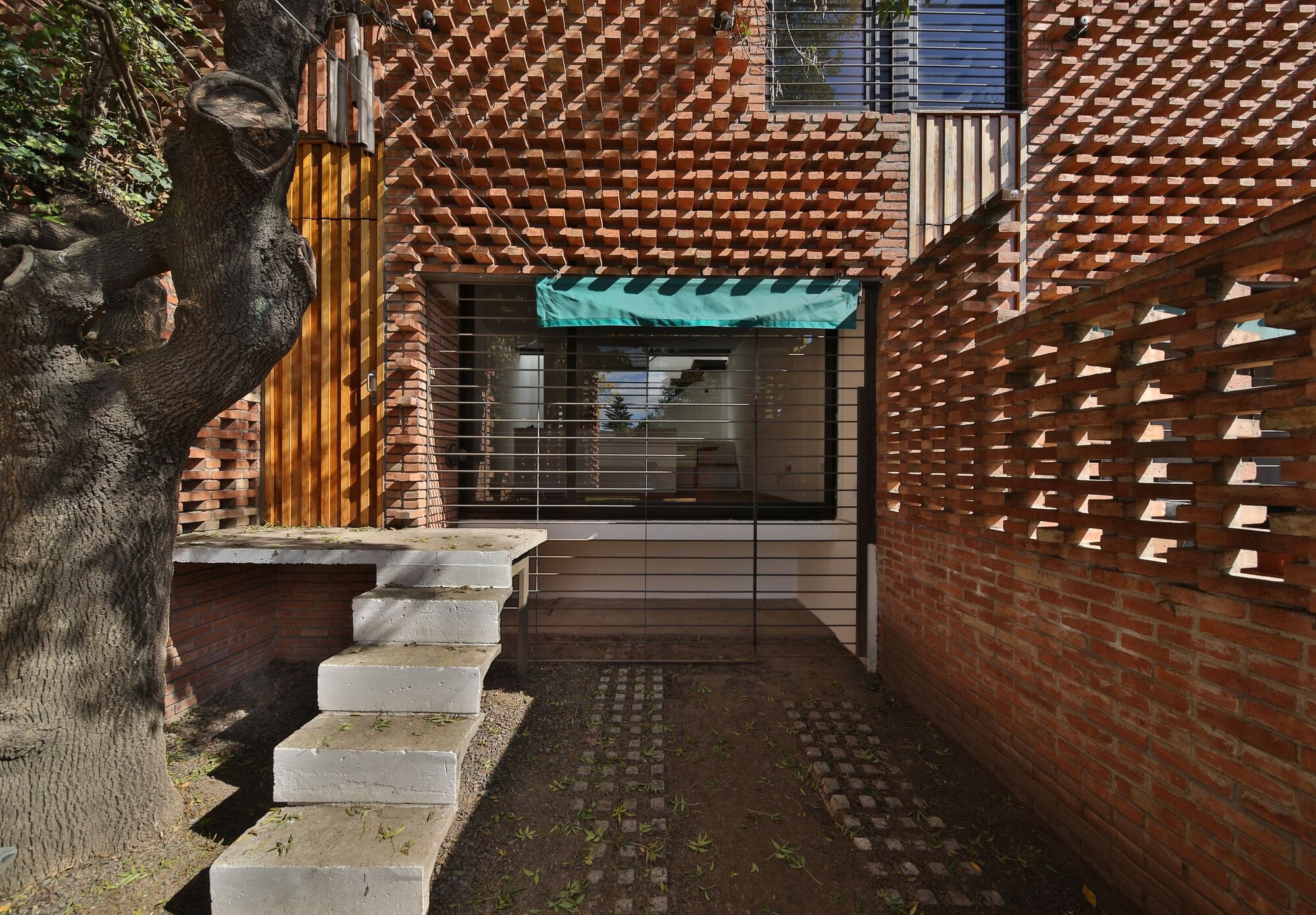Francisco Cadau Weaves a Brick Curtain Across Four Row Houses in Campana, Argentina