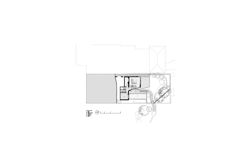Second floor plan showing a terrace deck with stairs descending to landscaped yard