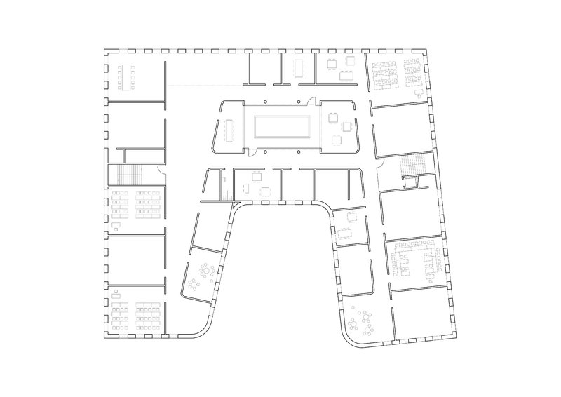 Upper floor plan drawing showing central atrium space surrounded by offices and support rooms