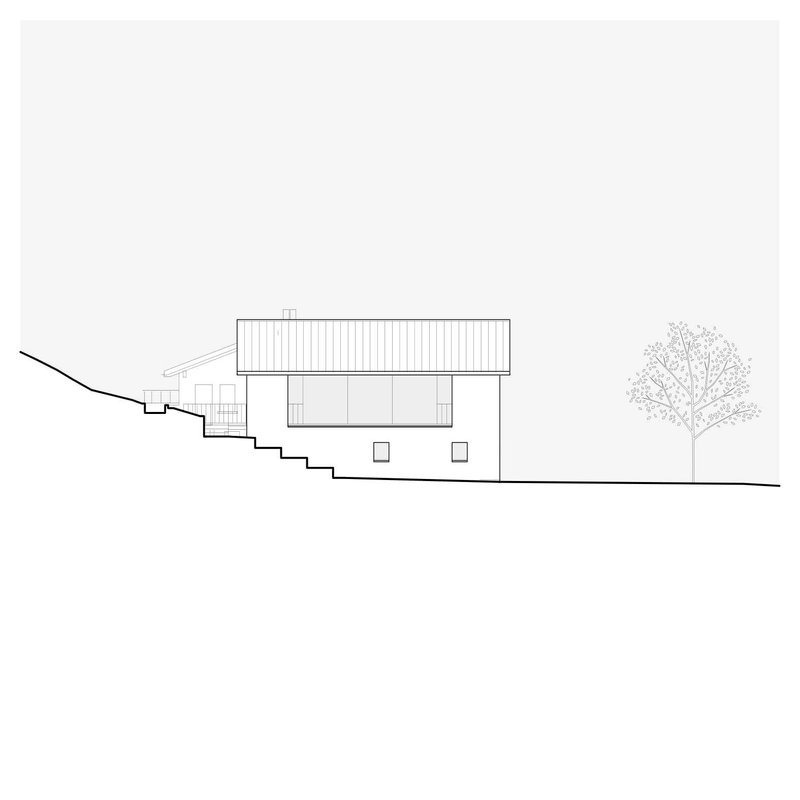 Section drawing showing a two-story structure with sloped roof stepping down a hillside with a tree
