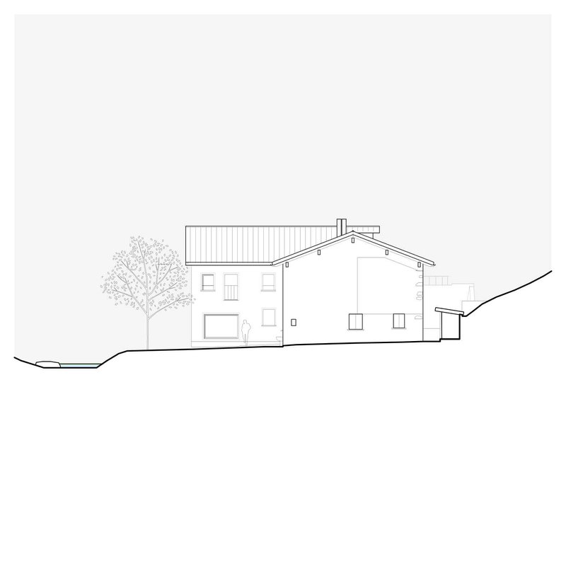 Elevation drawing displaying the rear facade with corrugated roof and figure in doorway near tree