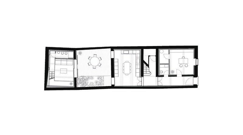 Floor plan drawing showing linear arrangement of bedroom, courtyard, dining, kitchen and stair