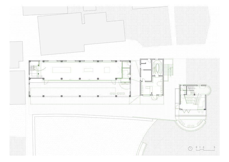 Ground floor plan drawing showing the long exhibition hall with structural columns and adjacent service rooms