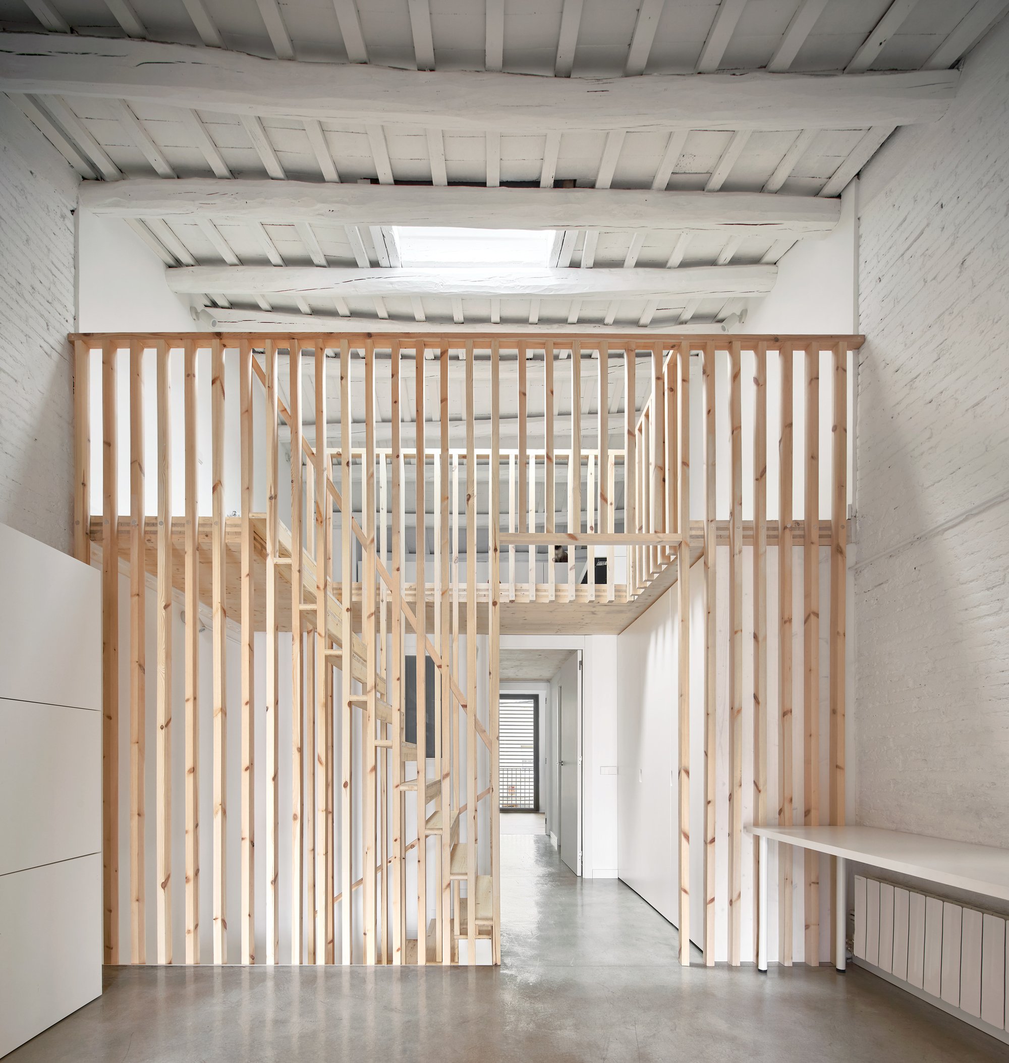 Vallribera Arquitectes Threads CLT and White Paint Through a Century-Old Terrassa Row House