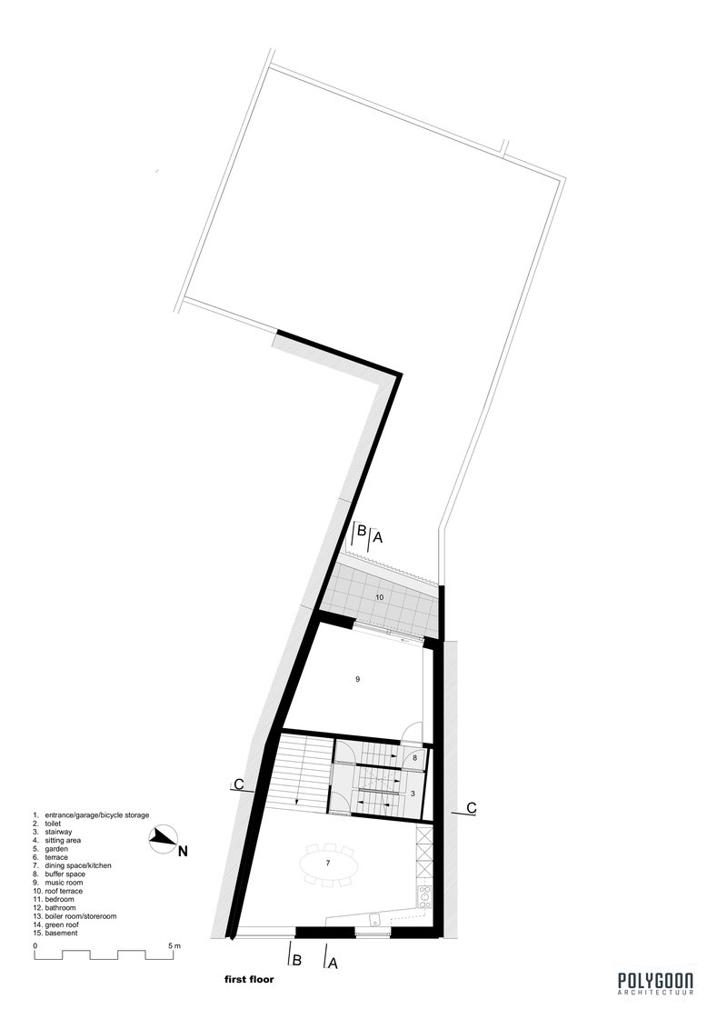 First floor plan drawing showing open living space and enclosed bathroom within angled walls
