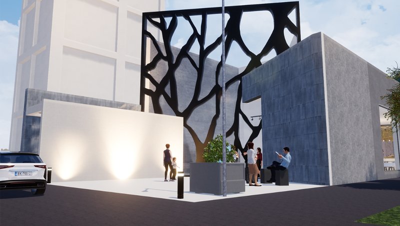 Street-level view showing SCAR’s concrete volumes, illuminated entry, and expressive façade as a memory marker.
