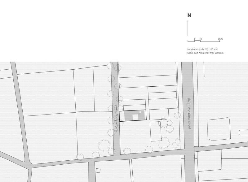 Site plan drawing showing a rectangular building footprint with surrounding streets and landscape elements