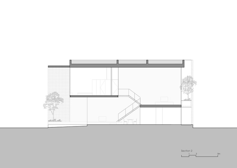 Section drawing revealing double-height spaces organized around a switchback stair with trees at edges