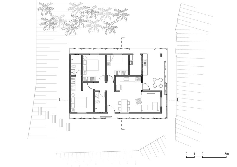 Floor plan drawing showing rectangular dwelling with bedrooms, kitchen, and dining adjacent to palm trees