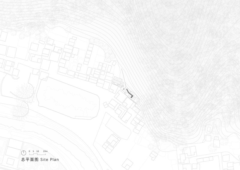 Site plan drawing showing curved structure positioned among contour lines with surrounding village fabric and topography