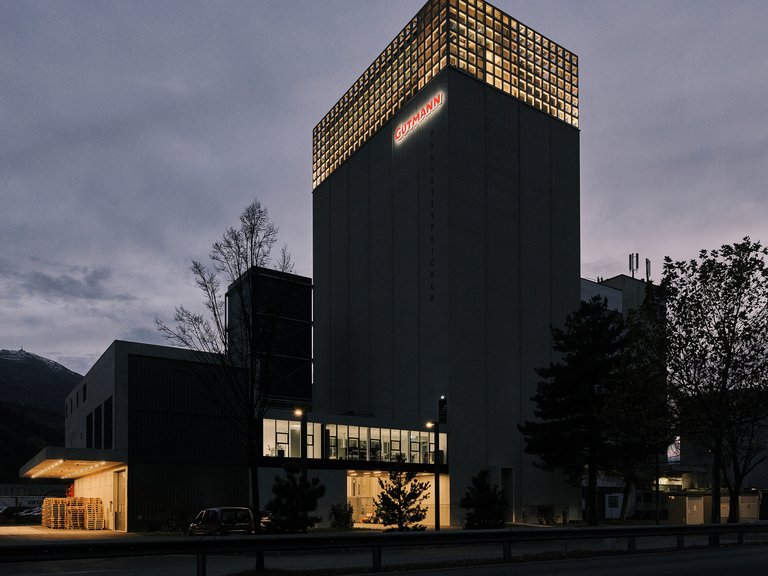 Two Firms Crown a 1978 Grain Silo in Tirol with Offices, Art, and a Biomass Power Plant