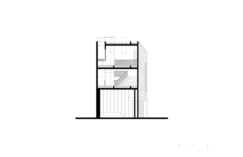 Section drawing showing a two-story volume with internal staircase and adjacent double-height space