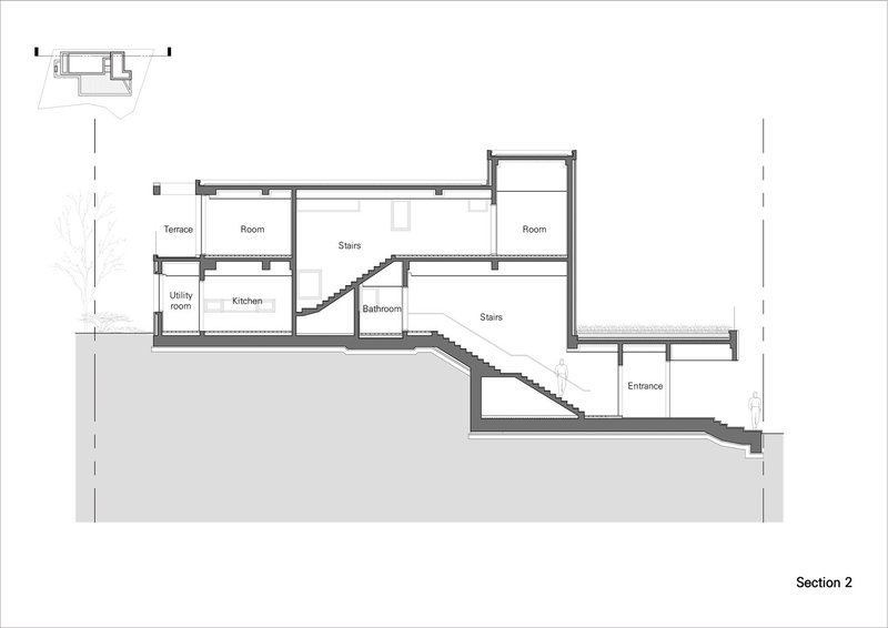 Section drawing showing split-level interior with cascading stairs connecting multiple floors carved into sloped terrain