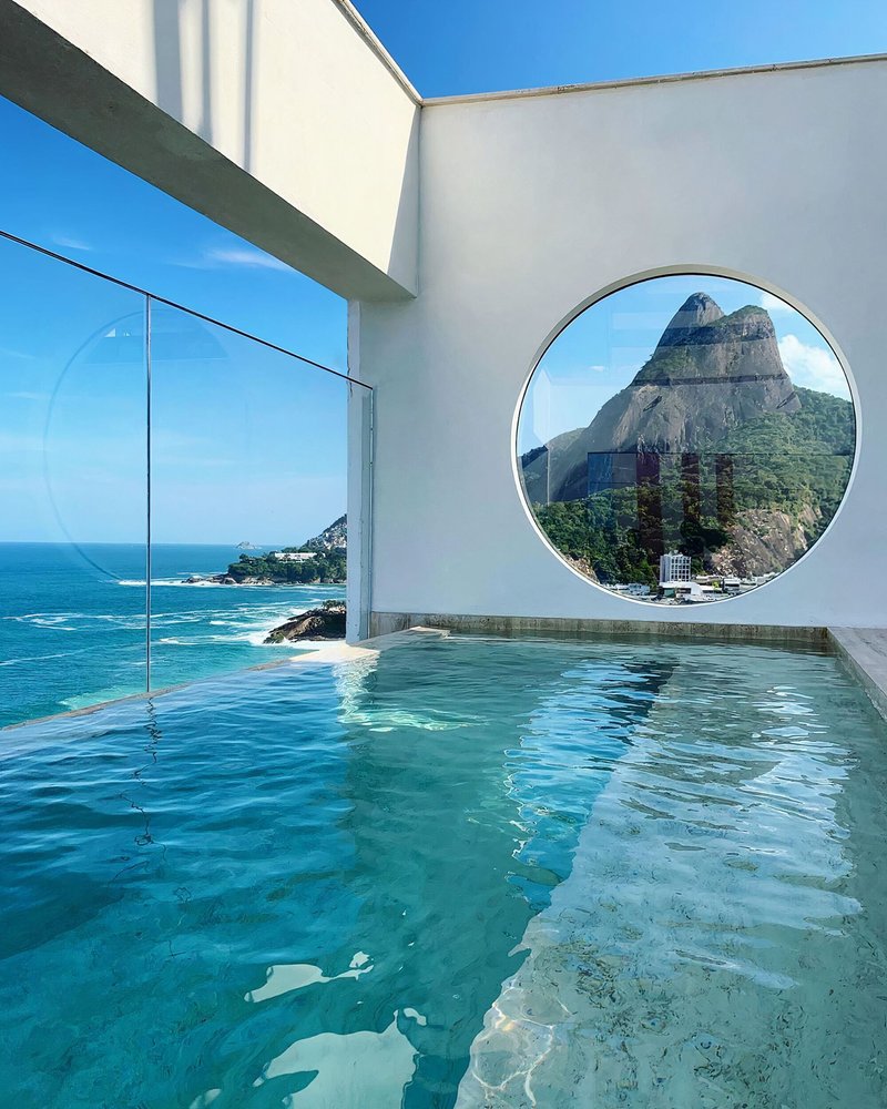 Siqueira + Azul Arquitetura Frame the Atlantic Through Circular Portals at Janeiro Hotel