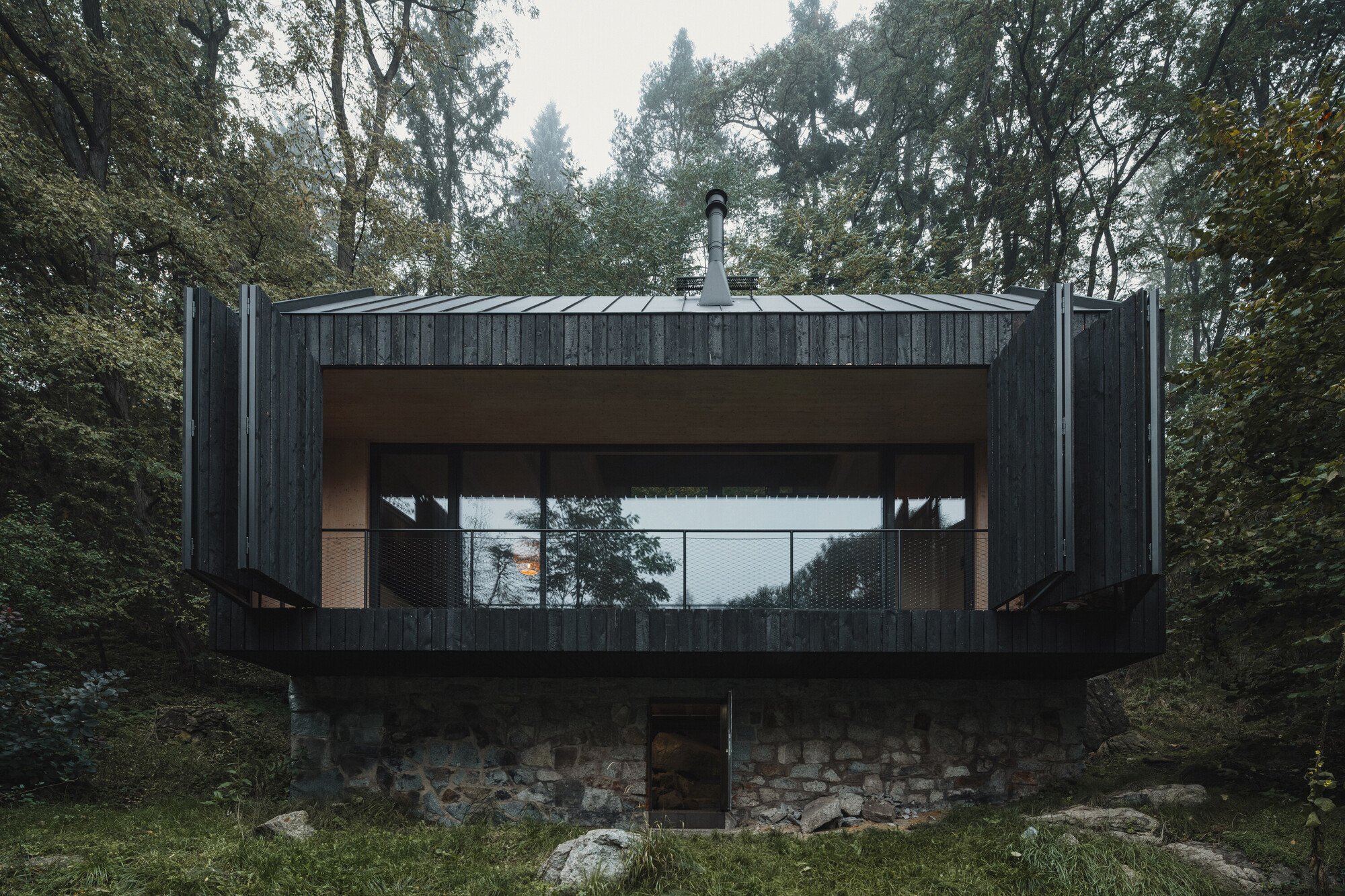 Mimosa Architects Rebuilds a Burned Czech Cabin from Its Own Stone Plinth