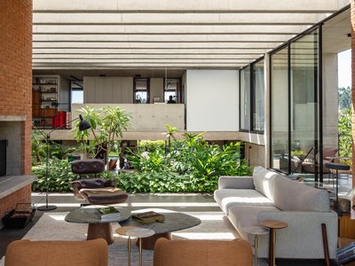 Obra Arquitetos Carves a Lush Internal Void into a Monolithic Brick House in Jundiaí