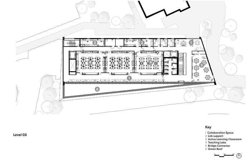 Floor plan drawing showing upper level with three classroom spaces and diagonal circulation spine