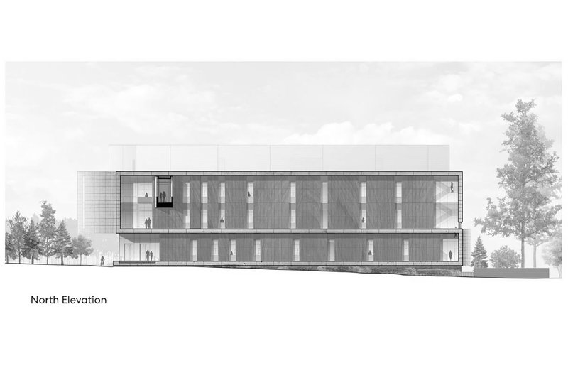 North elevation drawing showing a two-story facade with vertical window bays flanked by mature trees