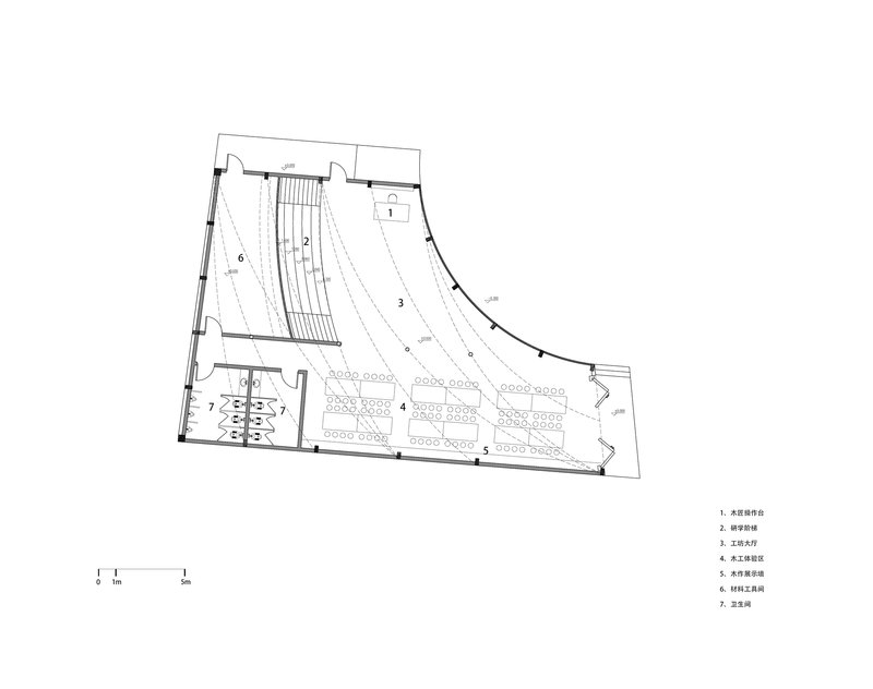 Floor plan drawing showing tiered seating hall with curved rows and adjacent circulation and service spaces