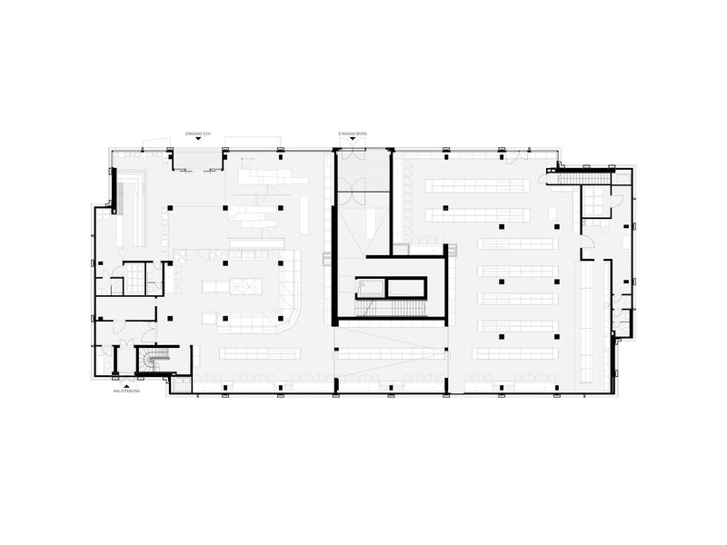 Floor plan drawing revealing large open areas flanking a central service core with support spaces