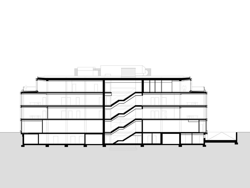 Section drawing showing four levels connected by diagonal staircases with a sloped roof above