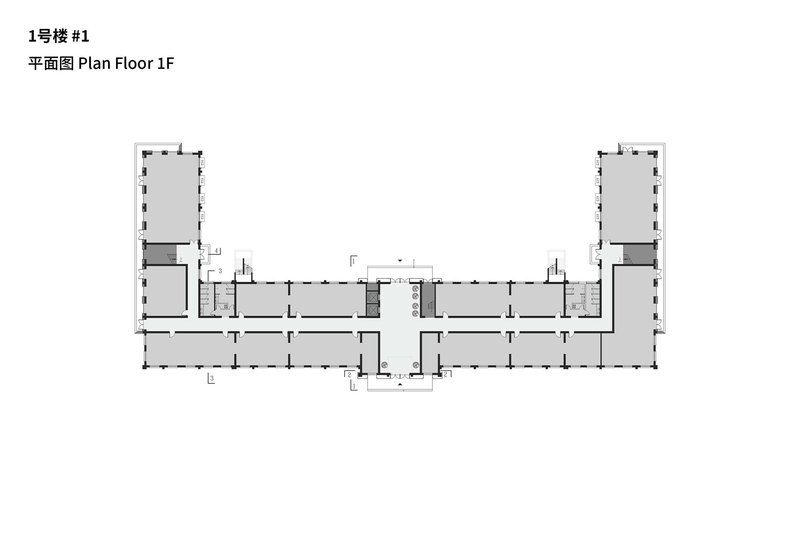 First floor plan showing a symmetrical U-shaped layout with corner pavilions and central entrance