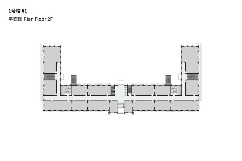 Second floor plan depicting mirrored wings flanking a central circulation core and stair volumes