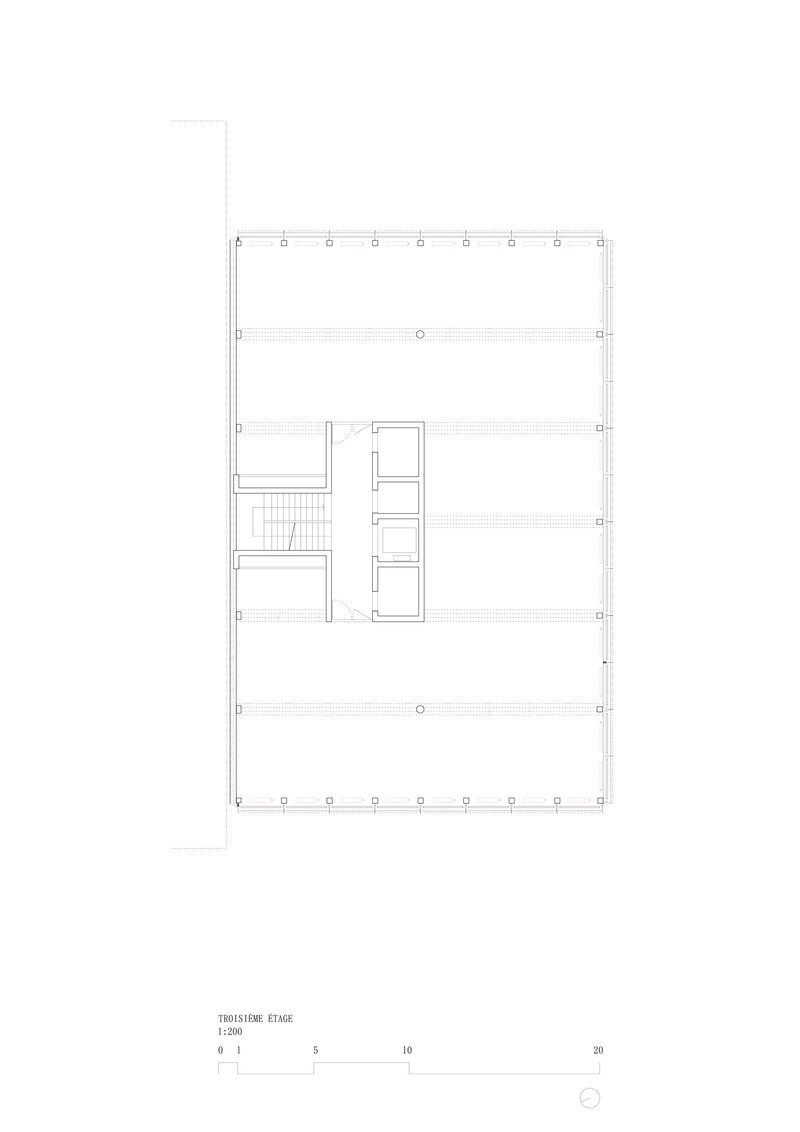 Floor plan drawing showing a central stair and elevator core with open space surrounding it