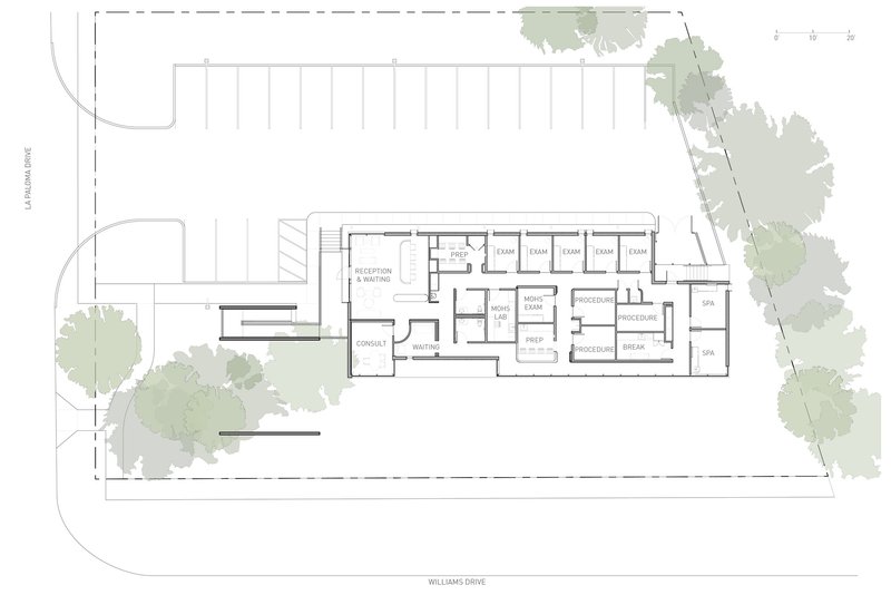 Site plan drawing showing the rectangular building footprint with parking grid and surrounding trees