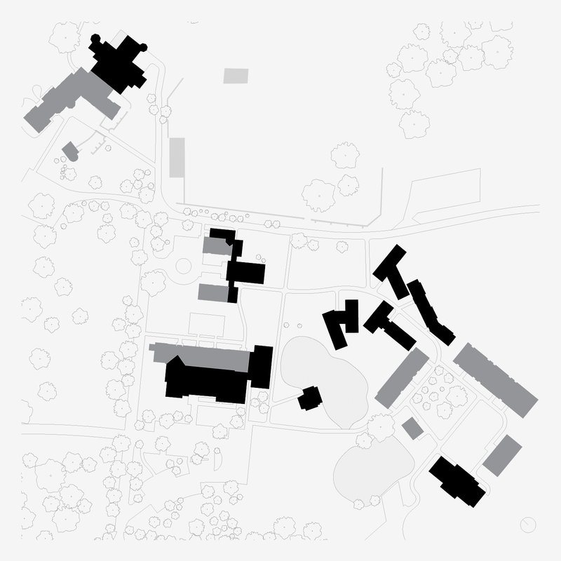 Site plan drawing showing scattered buildings and pathways with tree canopy outlines