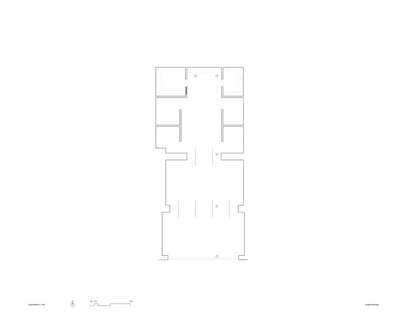 Floor plan drawing showing rectangular layout with rooms arranged around central circulation spaces